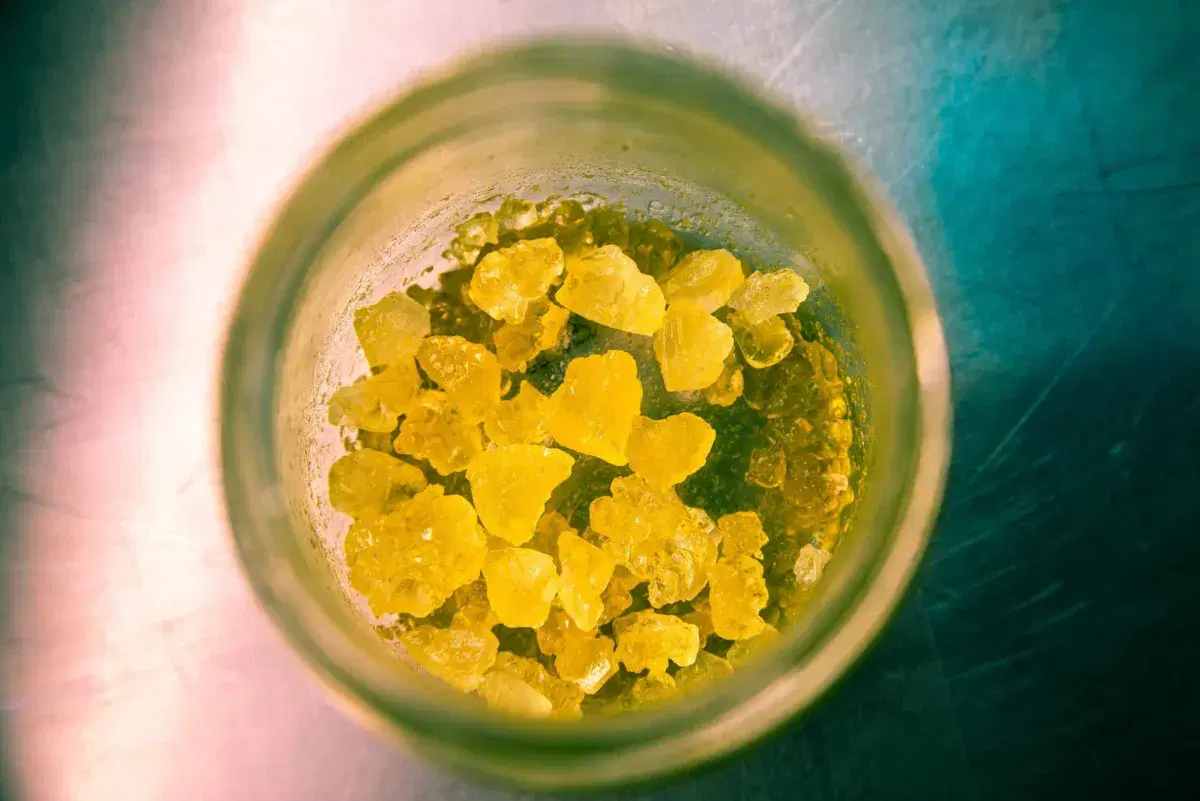 yellow cannabis gummies in a glass jar