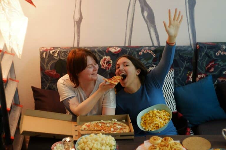 women eating while watching a movie